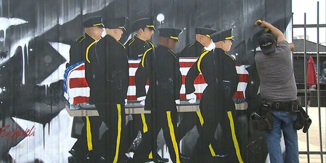 The mural on property of Last Call Lounge in Dallas, which paid tribute to fallen officers on one-year anniversary of the ambush on them.