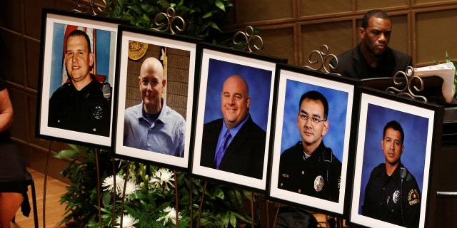 Photographs of officers Michael Krol, Brent Thompson, Lorne Ahrens, Michael Smith, and Patrick Zamarripa were displayed during a memorial service.