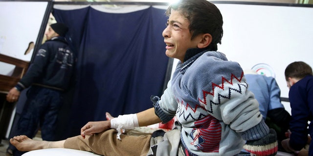 A wounded boy reacts in a hospital in Douma after an airstrike on the rebel-held town of Mesraba, in the rebel-held besieged town of Douma, eastern Ghouta in Damascus, Syria, November 26, 2017.