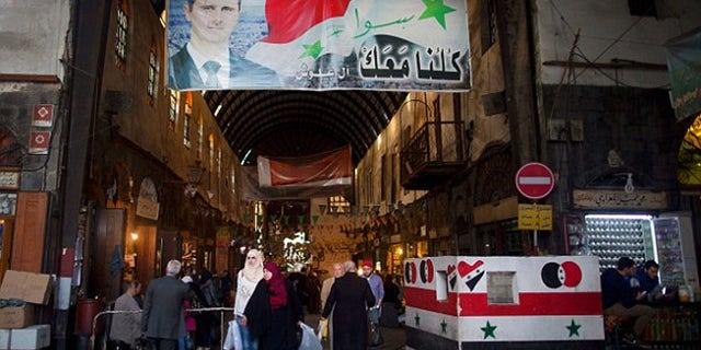 Even as the war encroaches on the capital, people in Damascus go about their business.
