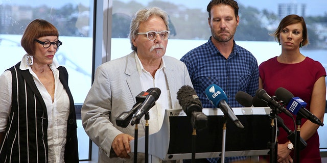 Dec. 21, 2017: John Ruszczyk, second from left, making a statement in Sydney.