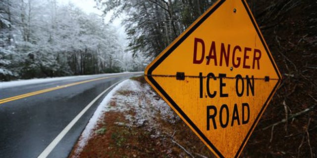 Richard Russell Scenic Hwy 348 is closed due to icy conditions on Tuesday, Feb. 11, 2014, just north of Helen, Ga. In a dire warning Tuesday, forecasters said a "catastrophic" winter storm threatened to bring a thick layer of ice to Georgia and other parts of the South, causing widespread power outages that could leave people in the dark for days. (AP Photo/Atlanta Journal-Constitution, Curtis Compton) MARIETTA DAILY OUT; GWINNETT DAILY POST OUT; LOCAL TV OUT; WXIA-TV OUT; WGCL-TV OUT