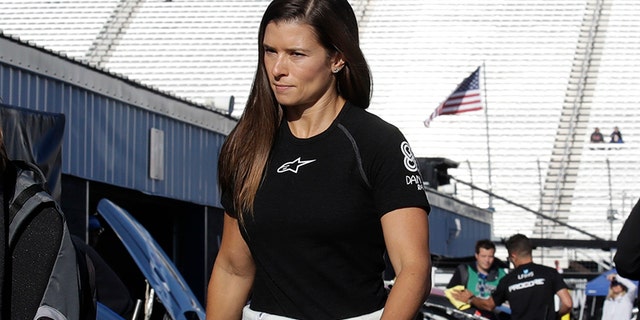 Danica Patrick walks to her garage prior to practice for the NASCAR Cup Series 300 auto race at New Hampshire Motor Speedway in Loudon, N.H., Saturday, Sept. 23, 2017. (AP Photo/Charles Krupa)