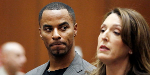 In this Feb. 20, 2014, file photo, Darren Sharper looks toward his attorney, Blair Berk, during an appearance in Los Angeles Superior Court in Los Angeles.