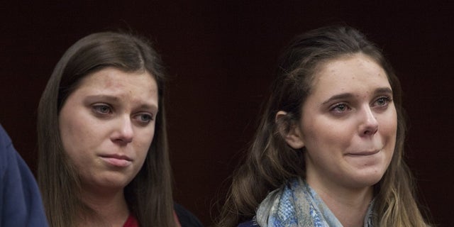 Madison Rae Margraves, right, reacts while giving a statement near her sister, Lauren Margraves, during Larry Nassar's sentencing at Eaton County Circuit Court in Charlotte, Mich., Feb. 2, 2018.