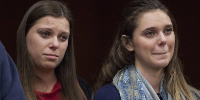 Madison Rae Margraves, right, reacts while giving a statement near her sister, Lauren Margraves, during Larry Nassar's sentencing at Eaton County Circuit Court in Charlotte, Mich., Feb. 2, 2018.