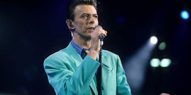 David Bowie performs "Under Pressure" (Photo by Kevin Mazur Archive/WireImage)