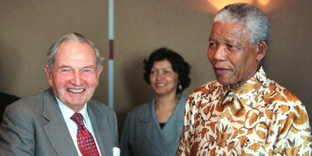 David Rockefeller, left, with Nelson Mandela in 1998.