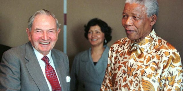 David Rockefeller, left, with Nelson Mandela in 1998.