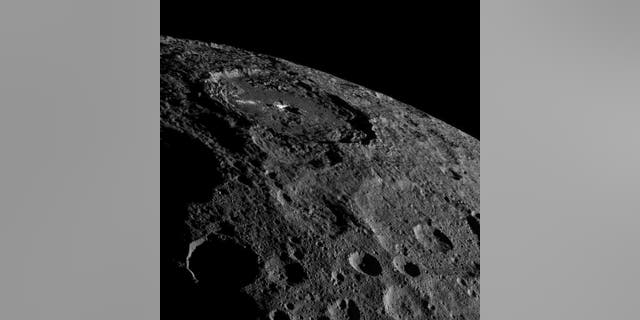 The strange bright spots of Occator Crater on the dwarf planet Ceres are unmistakable in this spectacular photo by NASA's Dawn spacecraft taken on Oct. 17, 2016 and released on Nov. 18 as Dawn moves into a higher orbit.