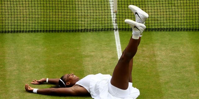 LONDON, ENGLAND - JULY 09: Serena Williams of The United States celebrates victory following The Ladies Singles Final against Angelique Kerber of Germany on day twelve of the Wimbledon Lawn Tennis Championships at the All England Lawn Tennis and Croquet Club on July 9, 2016 in London, England. (Photo by Julian Finney/Getty Images)