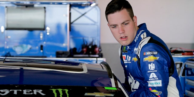 Alex Bowman climbs in his car during a practice session for the NASCAR Daytona 500 auto race at Daytona International Speedway, Saturday, Feb. 17, 2018, in Daytona Beach, Fla.