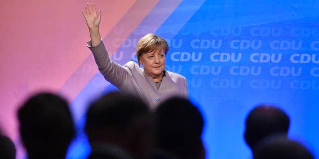 German chancellor Angela Merkel waves to supporters during an election campaign in Oelde, Germany, for the upcoming state elections in North Rhine-Westphalia, Thursday, April 27, 2017. Germany's most populated province elects a new parliament on May 14. (AP Photo/Martin Meissner)
