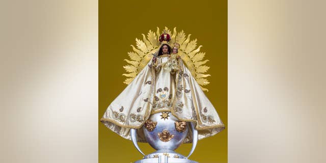 A statue of the Virgin of Charity sits on the altar where Pope Francis will celebrate a Mass, in the Plaza of the Revolution, in Havana, Cuba, Thursday, Sept. 17, 2015. Francis will honor Cuba’s patron the Virgin of Charity, Sept. 21 & 22 at a shrine outside Santiago. (AP Photo/Desmond Boylan)