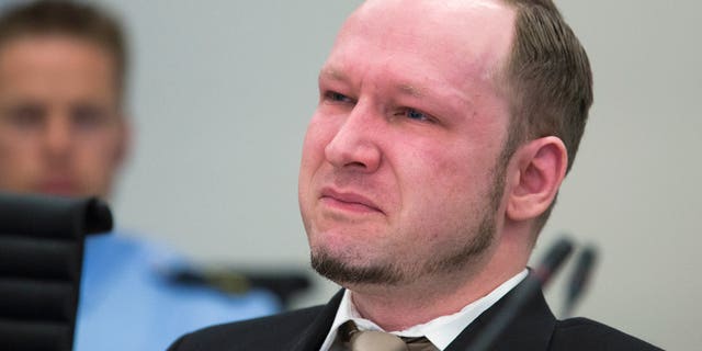 April 16, 2012: Norwegian Anders Behring Breivik, who is facing terrorism and premeditated murder charges, reacts as a video presented by the prosecution is shown in court, Oslo, Norway.