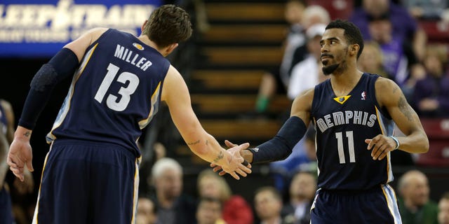 Memphis Grizzlies forward Mike Miller, left, congratulates teammate Mike Conley after Conley scored against the Sacramento Kings during the fourth quarter of an NBA basketball game in Sacramento, Calif., Wednesday, Jan. 29, 2014. The Grizzlies won 99-89.(AP Photo/Rich Pedroncelli)