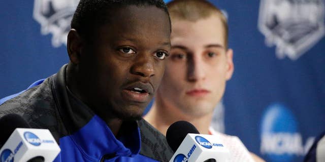 Kentucky's Julius Randle, left, and Wisconsin's Ben Brust participate in a news conference for their NCAA Final Four tournament college basketball semifinal game Thursday, April 3, 2014, in Dallas. (AP Photo/David J. Phillip)