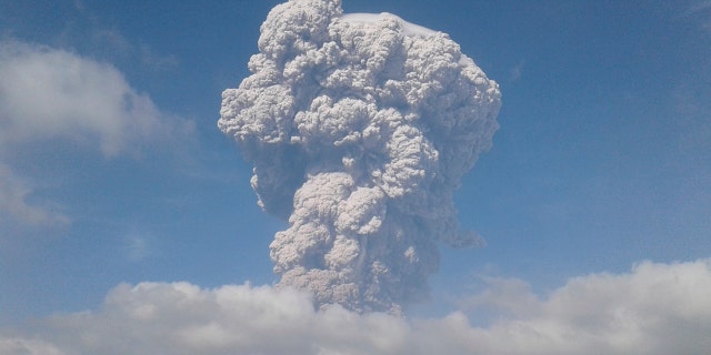 Mount Sinabung spews volcanic ash as it erupts in Karo, North Sumatra, Indonesia, Monday, Feb. 19, 2018.