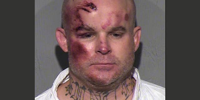 FILE - This undated file booking photo provided by the Maricopa County Sheriff's Office shows Ryan Giroux, 41, who Mesa police say committed a string of crimes that included a motel shooting, a carjacking and a home invasion that ended with the suspect's arrest on Wednesday, March 18, 2015. Giroux pleaded not guilty on Monday, April 6, 2015 to killing one person and wounding five others in a suburban Phoenix rampage that included multiple shootings, a carjacking and a home invasion. (AP Photo/Maricopa County Sheriff's Office,File)
