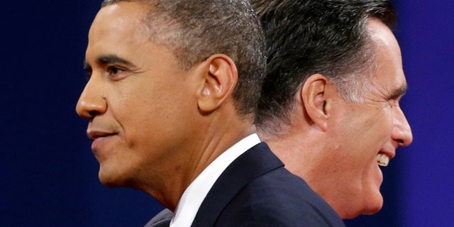 FILE: Oct 16, 2012: Mitt Romney and President Obama walks past each other at the end of their last debate at Lynn University, in Boca Raton, Fla.