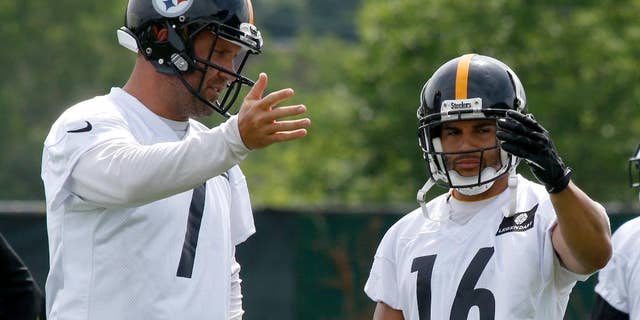 Pittsburgh Steelers quarterback Ben Roethlisberger (7) and wide receiver Lance Moore (16) talk about pass routes during an NFL football organized team activity on Wednesday, June 11, 2014 in Pittsburgh. (AP Photo/Keith Srakocic)
