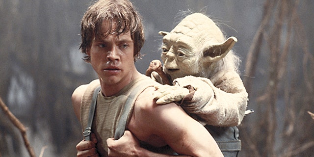 This 1980 publicity image originally released by Lucasfilm Ltd. shows Mark Hamill as Luke Skywalker and the character Yoda in a scene from 'Star Wars Episode V: The Empire Strikes Back.'