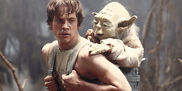This 1980 publicity image originally released by Lucasfilm Ltd. shows Mark Hamill as Luke Skywalker and the character Yoda in a scene from 'Star Wars Episode V: The Empire Strikes Back.'