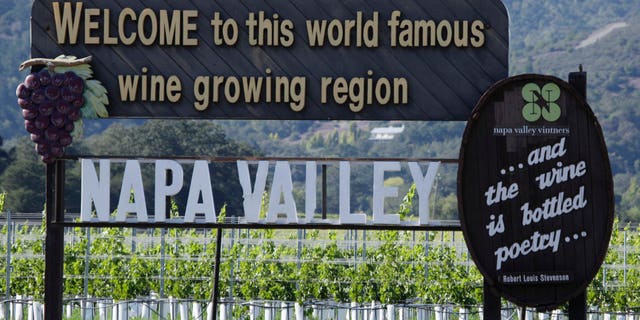 FILE - In this Oct. 27, 2011 file photo is a sign along Highway 29 welcoming visitors to the Napa Valley in Oakville, Calif. Highway 29 is a straight shot from the south end of the valley through Napa, Yountville, Oakville, Rutherford, St. Helena and Calistoga. Along the way are dozens of restaurants and wineries, including the Robert Mondavi Winery and Inglenook, the winery restored by director Francis Ford Coppola. (AP Photo/Eric Risberg, File)