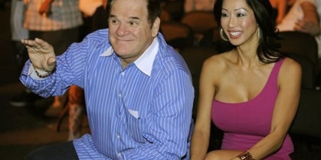 Sept, 26, 2009: Former major league baseball player Pete Rose, left, is joined by an unidentified companion before the start of a heavyweight fight between Vitali Klitschko and Chris Arreola in Los Angeles. (AP)