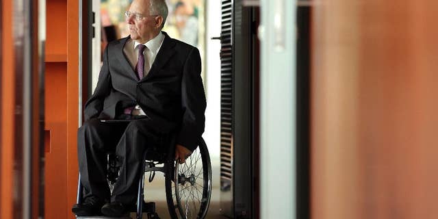 German Finance Minister Wolfgang Schaeuble arrives for the weekly cabinet meeting at the Chancellery in Berlin, Germany, Wednesday, May 18, 2016. (AP Photo/Michael Sohn)