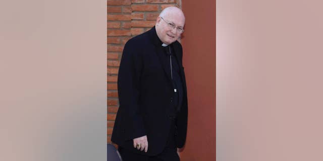 In this July 25, 2014 photo, Bishop Rogelio Ricardo Livieres Plano walks to church in Ciudad del Este, Paraguay. Livieres Plano, a member of the conservative Opus Dei movement, has been removed by Pope Francis from a Paraguayan diocese said the Vatican Thursday, Sept. 25, 2014, after he clashed with his fellow bishops by opening his own seminary and promoting an Argentine priest accused of inappropriate sexual behavior. (AP Photo/ABC, Raul Gonzalez)
