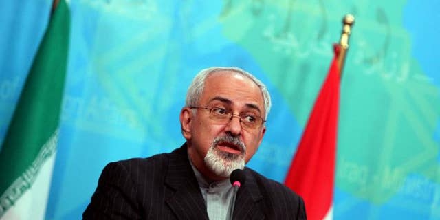 Iranian Foreign Minister Mohammad Javad Zarif speaks during a press conference in Baghdad on September 8, 2013