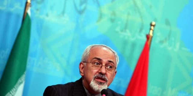 Iranian Foreign Minister Mohammad Javad Zarif speaks during a press conference in Baghdad on September 8, 2013