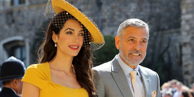 Amal and George Clooney head to the ceremony at St. George's Chapel.