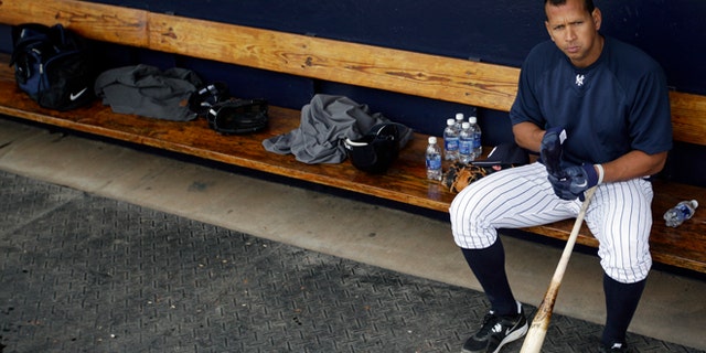 Feb. 25, 2012: New York Yankees' Alex Rodriguez sits in the dugout during practice at baseball spring training in Tampa, Fla. (AP/Matt Slocum, File)