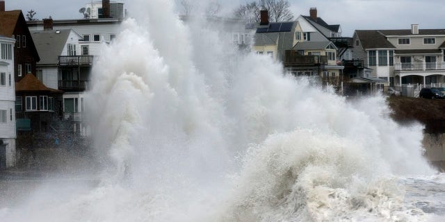 A large wave crashes into a seawall in Winthrop, Mass., Saturday, March 3, 2018, a day after a nor'easter pounded the Atlantic coast.