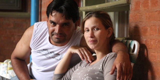 Analia Bouter and her husband Fabian Veron pose for a photo outside the hospital in Resistencia, Argentina, Wednesday April 11, 2012. (AP Photo/Juan Pablo Faccioli)