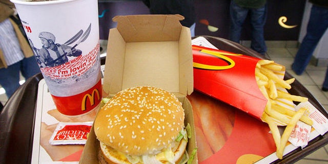 ** FILE ** A Big Mac, Coke and fries are shown at a McDonald's, Oct. 20, 2005 in New York. As part of its assault on obesity, New York City's health department has a plan to require some restaurants to list the calorie content of their food on their menus. If the rule is approved, the brightly lit menu boards that hang over the counter at McDonald's might read something like this: Double cheeseburger, $1 ... 460 calories. (AP Photo/Mark Lennihan)