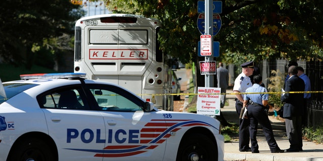 Oct. 17, 2014: A cordoned-off police area is seen near a charter bus after an Ebola scare in Washington.