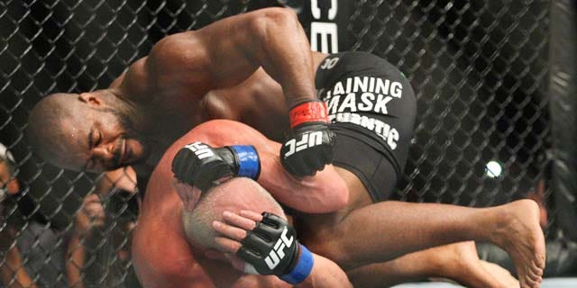 Rashad Evans, top, works against Tito Ortiz during a light heavyweight bout at UFC 133 on Saturday, Aug. 6, 2011, in Philadelphia. (AP Photo/The News-Journal, Suchat Pederson) NO SALES