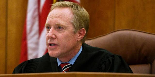 FILE - This Dec. 13, 2011, file photo, Judge Thomas Low speaks during a sentencing hearing at the 4th District Court in American Fork, Utah. A Utah judicial oversight commission representative says the number of comments about Low calling a convicted rapist a "good man" during his sentencing hearing has nearly tripled since Friday, April 14, 2017. Jennifer Yim said Monday, April 17, 2017, that she has received in total about 120 emails, phone calls and Facebook messages about Judge Thomas Low. The messages started coming in late March when Low came under scrutiny for letting Keith Robert Vallejo out of custody after a jury found him guilty of 10 counts of forcible sexual abuse and one count of object rape.(Chris Detrick/The Salt Lake Tribune, via AP, Pool, File)