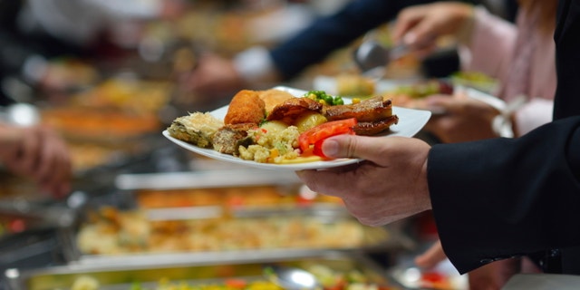 people group catering buffet food indoor in luxury restaurant with meat colorful fruits and vegetables