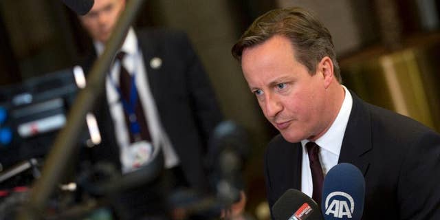 British Prime Minister David Cameron speaks with the media after an EU summit in Brussels on Friday, June 26, 2015. European leaders have tasked finance ministers from the euro countries with concluding a debt financing agreement with Greece over the weekend, just days before Athens has to meet a crucial debt deadline. (AP Photo/Virginia Mayo)