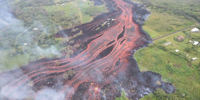"Fast-moving" lava flows threatened to cut off a major escape route for Puna residents.