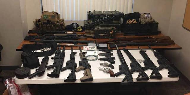 A search of Johnston's house yielded a cache of weapons and explosive devices, federal prosecutors said.