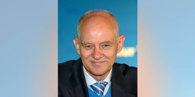 FILE - In this July 3, 2016 file photo top candidate of the nationalist party Alternative for Germany, AfD, for elections in the western state of Saarland next year Rudolf Mueller poses for a photo in Voelklingen, Germany. Mueller allegedly sold medals and currency used in Nazi internment camps at his antiques store. Saarbruecken prosecutors said Thursday, Sept. 22, 2016, that they are probing whether Mueller broke the law banning the use of symbols deemed to be in breach of Germany's constitution. (Oliver Dietze/dpa via AP, file)