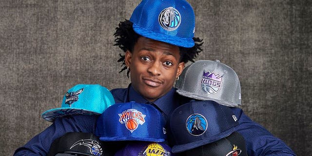 NEW YORK, NEW YORK - MAY 16: Draft prospects De'Aaron Fox poses with draft caps for portraits prior to the 2017 NBA Draft Lottery at the NBA Headquarters in New York, New York. NOTE TO USER: User expressly acknowledges and agrees that, by downloading and or using this Photograph, user is consenting to the terms and conditions of the Getty Images License Agreement. Mandatory Copyright Notice: Copyright 2017 NBAE (Photo by Jennifer Pottheiser/NBAE via Getty Images)