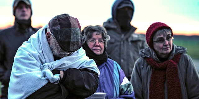 FILE: Jan. 7, 2014: A family from Daytona, Ohio protest against the death penalty in front of the Florida State Prison near Starke, Fla.