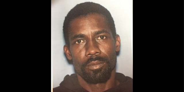 Alrick Powell, 39, is accused of dousing his wife with lighter fluid and setting her on fire.
