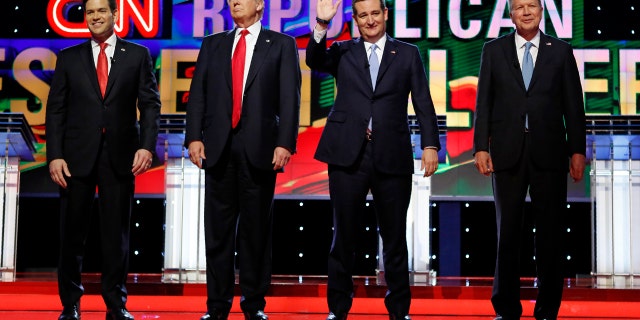 Republican U.S. presidential candidates (L-R) Marco Rubio, Donald Trump, Ted Cruz and John Kasich stand together onstage at the start of the Republican candidates debate sponsored by CNN at the University of Miami in Miami, Florida, March 10, 2016. REUTERS/Joe Skipper - RTSA9ZC